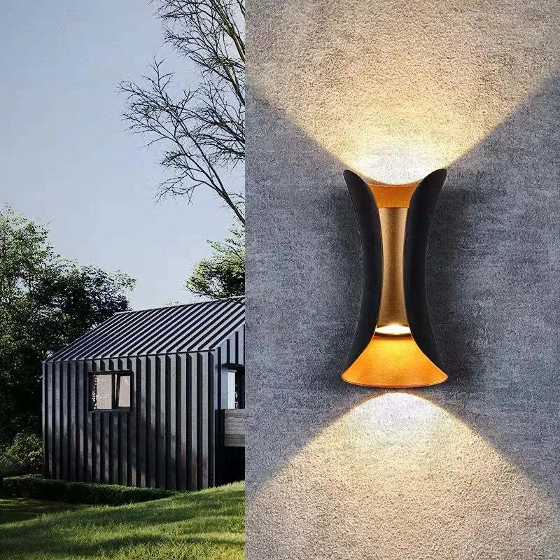 Modern outdoor LED wall light with curved design directing light up and down