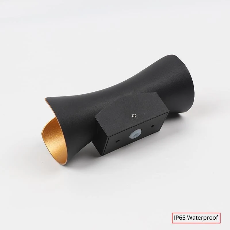 Modern outdoor LED wall light with curved design directing light up and down