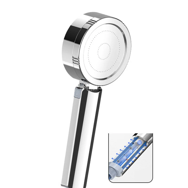 Adjustable handheld shower head with self-cleaning nozzles