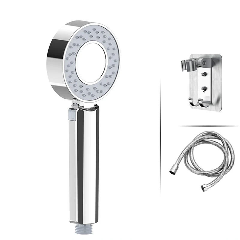 Adjustable handheld shower head with self-cleaning nozzles
