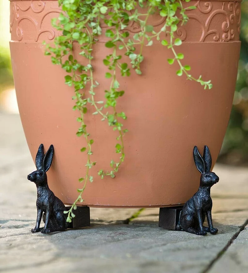 Set of garden pot supports shaped like animals