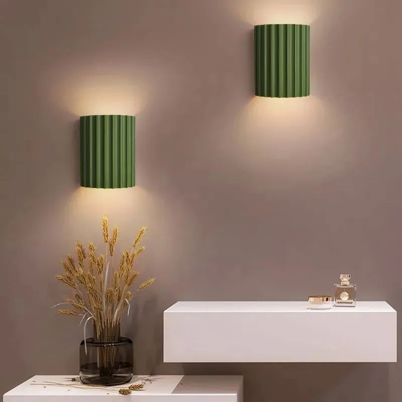 Elegant round wall lamp in soft colors