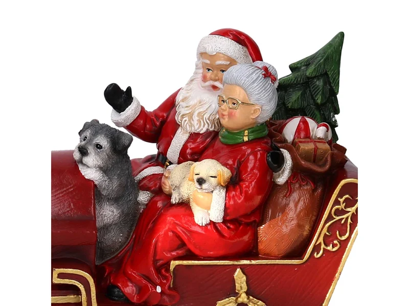 Babbo Natale in resina su treno rosso 32xh.21,5cm