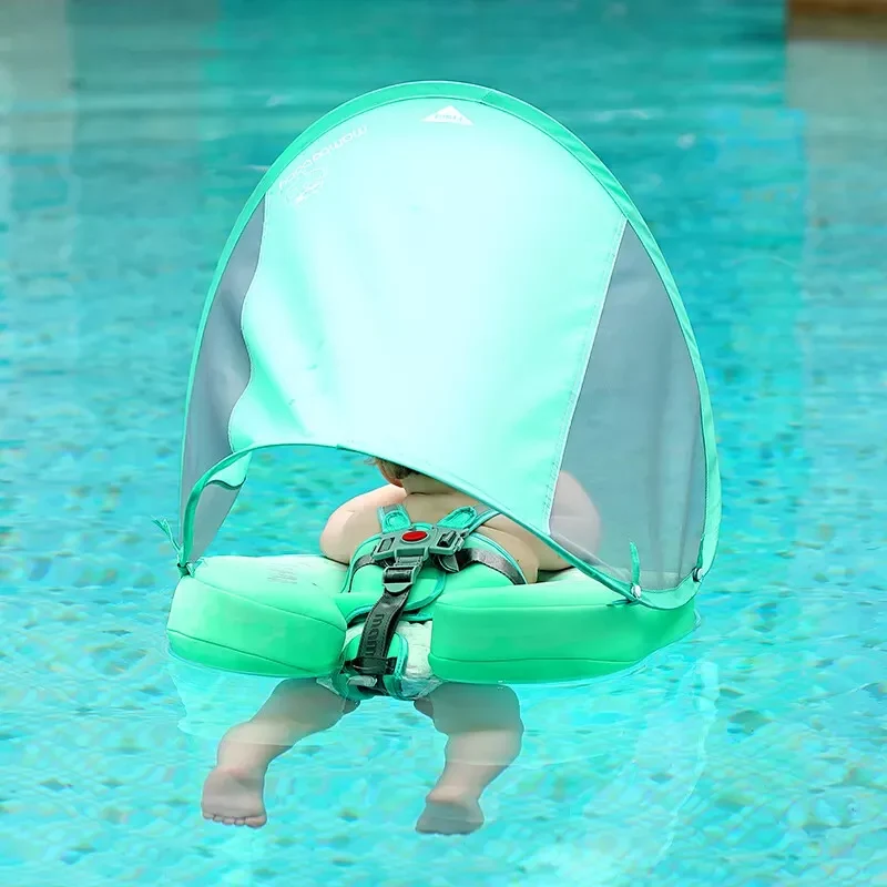 Infant Swimmer with Swimming Trainer Learning Aid