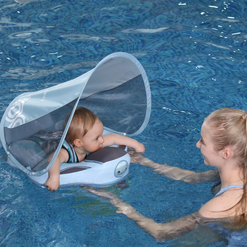Infant Swimmer with Swimming Trainer Learning Aid