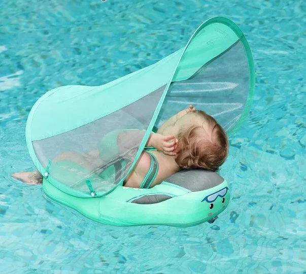 Infant Swimmer with Swimming Trainer Learning Aid