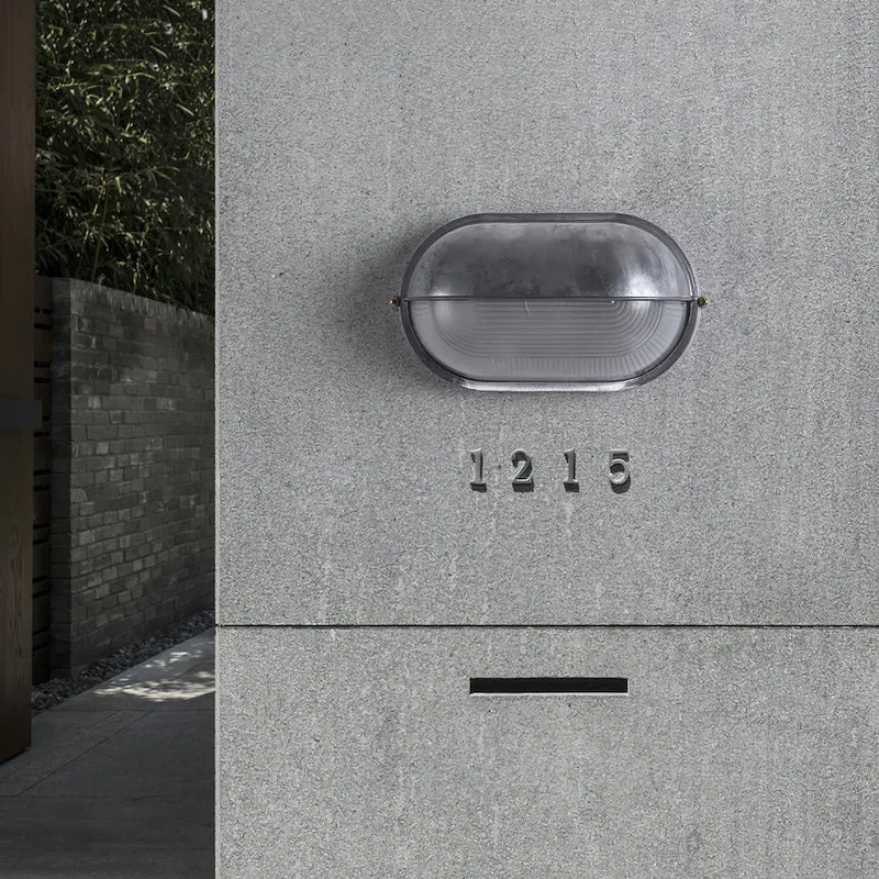 Outdoor industrial bulkhead wall lamp Oval weather-resistant design