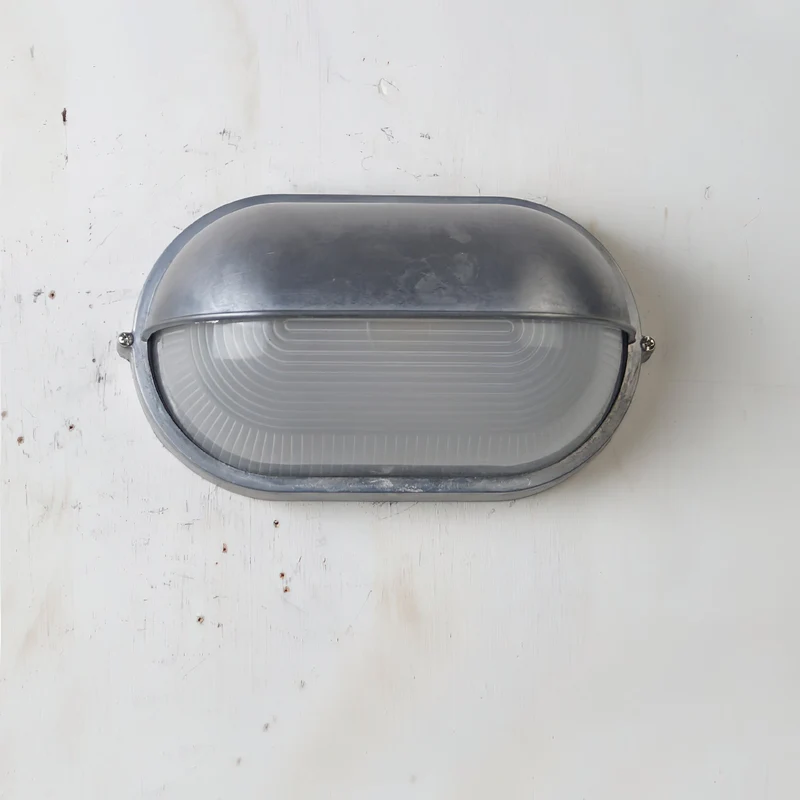 Outdoor industrial bulkhead wall lamp Oval weather-resistant design