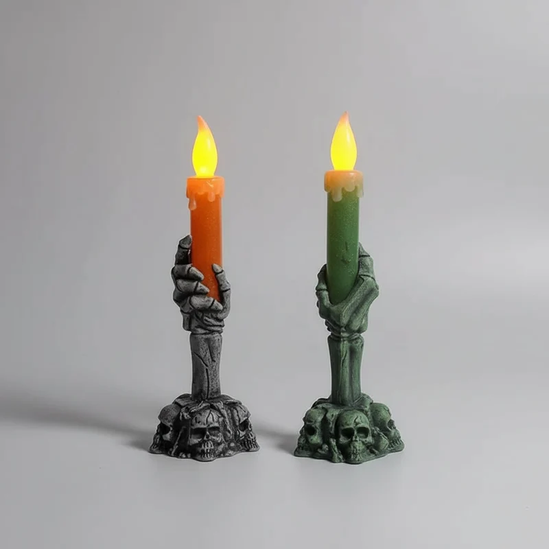 Decorative Halloween LED candle in a skeleton's hand with bats and skulls