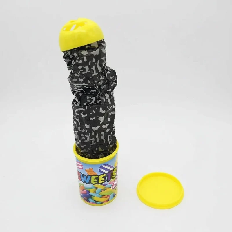 Halloween prank: spring-loaded snake jumping out of a can, chips—trick or treat after the chips